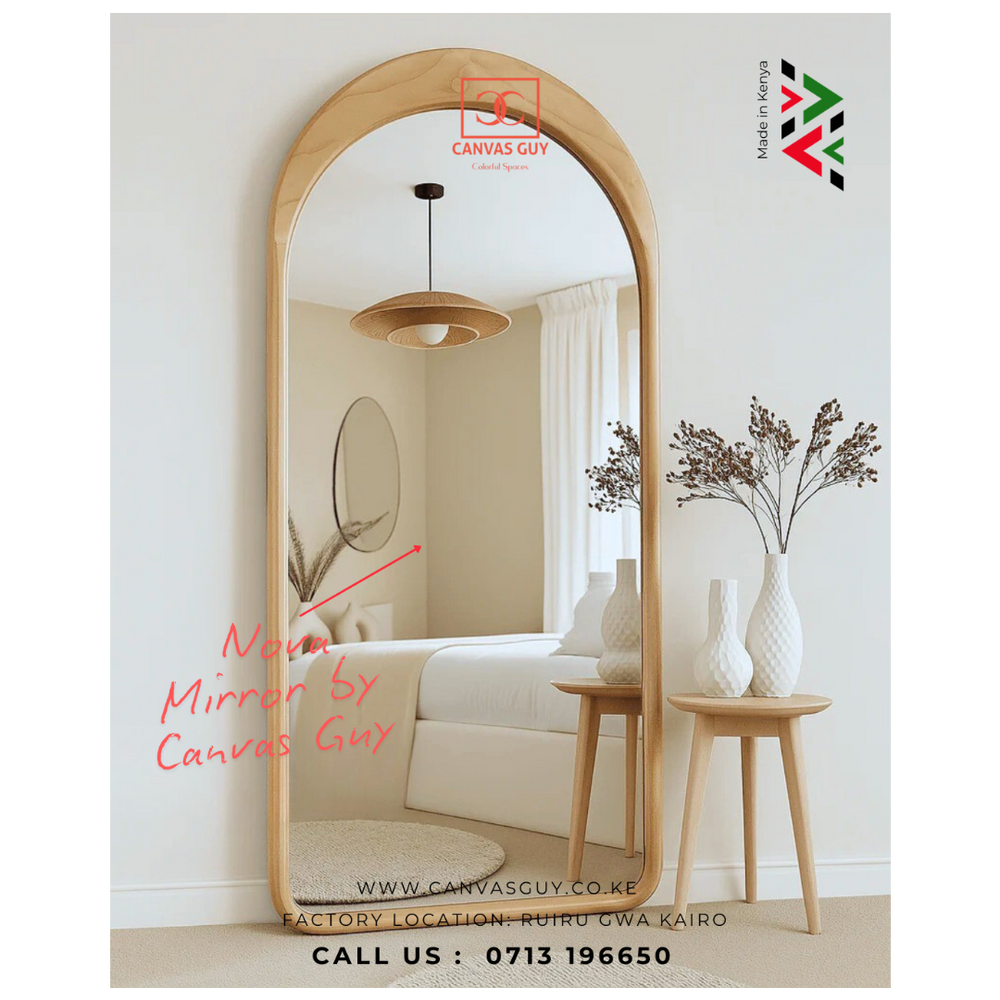 Wooden floor mirror in a room setting with decor elements, featuring the brand 'Canvas Guy'.