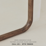 Wooden frame on a light background with Canvas Guy branding.
