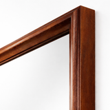 Close-up of a wooden frame corner on a white background