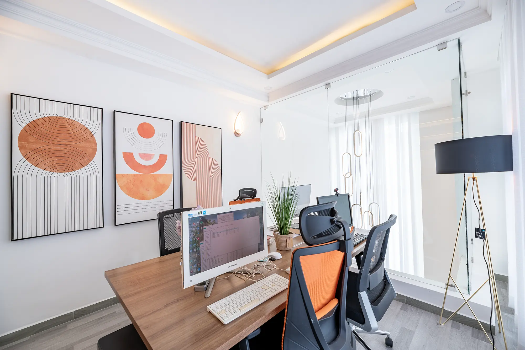 Home office setting featuring walls adorned with canvases, each capturing distinct Kenyan artistry and motifs, emphasizing the unique touch and elegance of local craftsmanship in a workspace environment